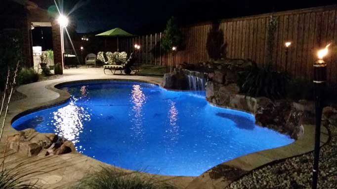 in ground pool with waterfall in sherman texas