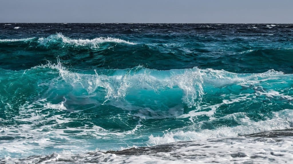 Ocean waves crash on a beach
